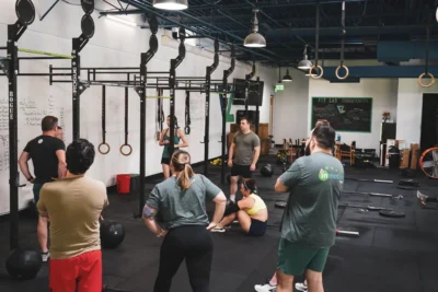 Group of athletes at Fit Lab Community gym with Rogue training equipment
